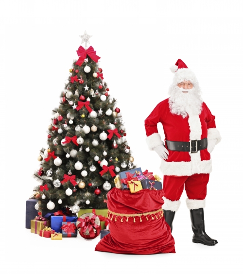 Santa standing next to a christmas tree